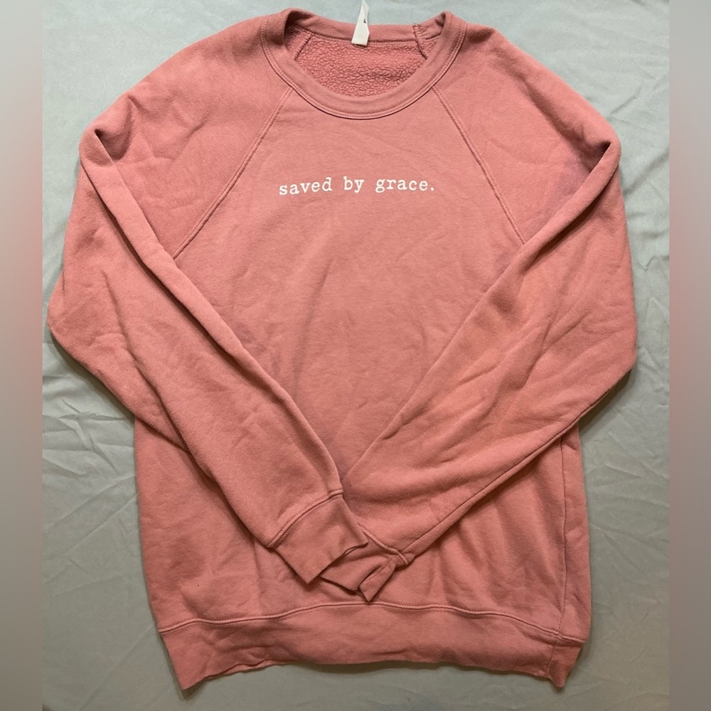 Peach Sweatshirt with 'Saved by Grace' Text